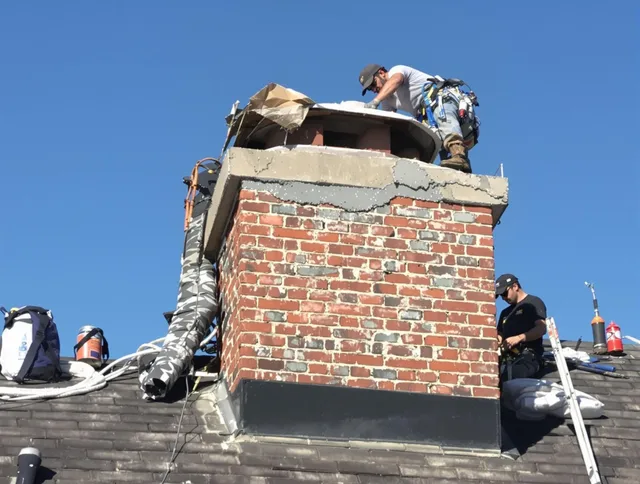 Farmington Chimney Sweep installing a custom chimney crown in Farmington, CT