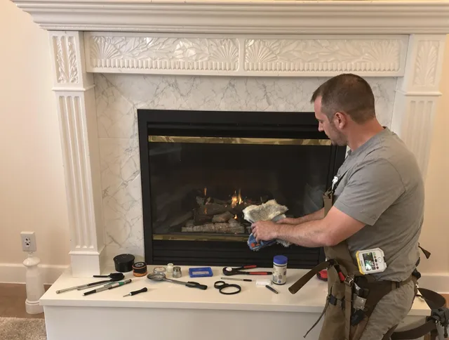 Farmington Chimney Sweep performing fireplace maintenance in Farmington, CT