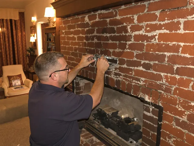 Farmington Chimney Sweep expert fixing a fireplace in Farmington, CT